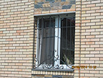 Кованая решетка на окно художественная ковка в Омске